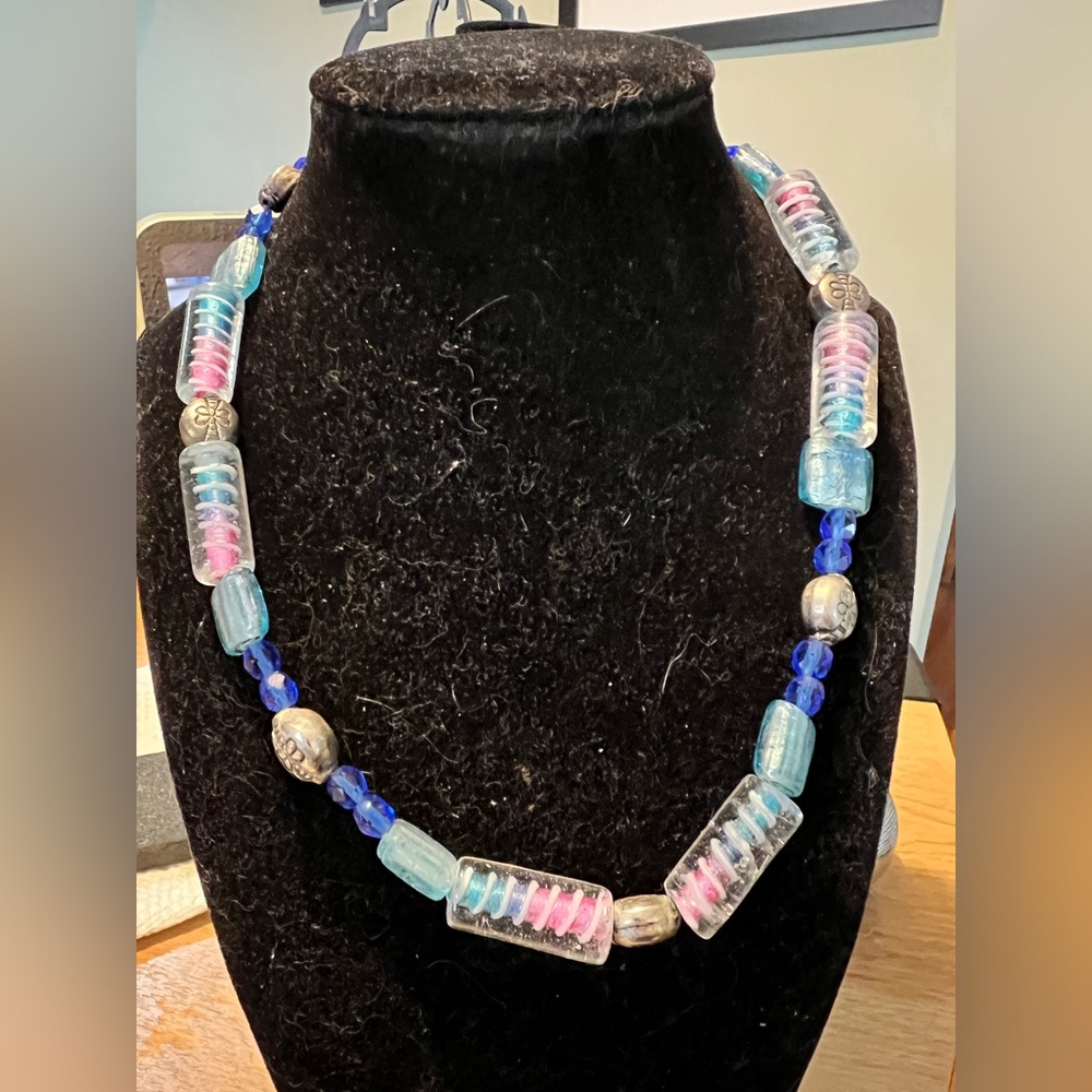 Vintage art glass necklace in blues and purples strung on a wire. 18”